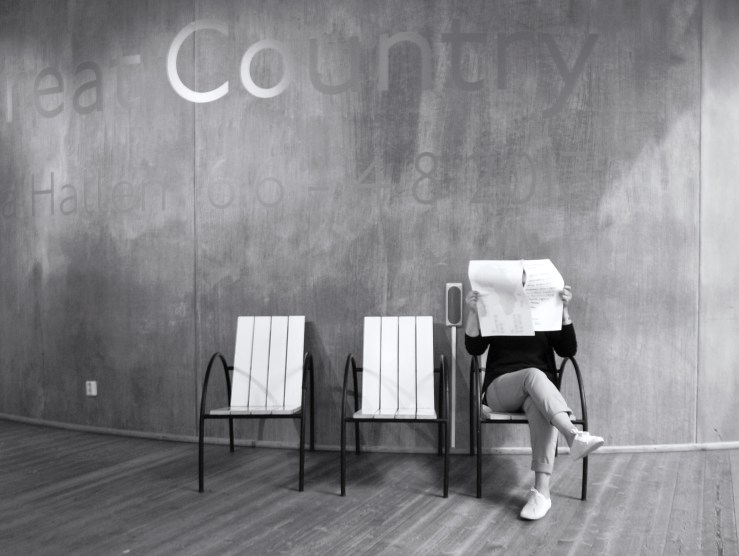 Behind the Newspaper